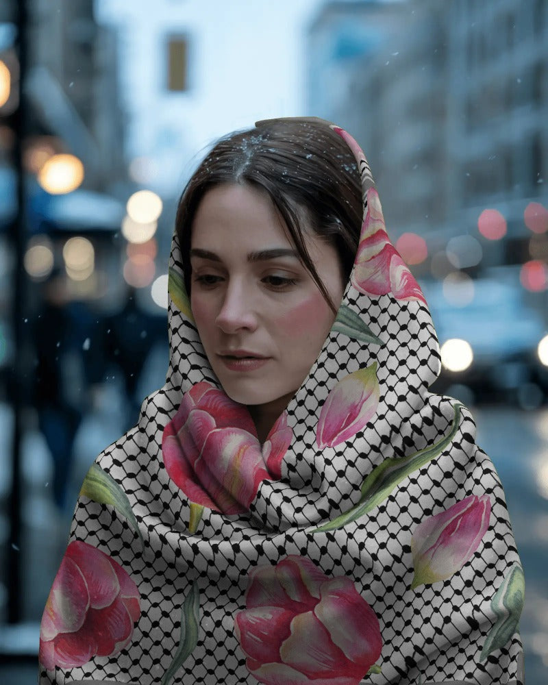 Woman wearing a Palestinian floral Kuffiyeh headscarf in an urban setting
